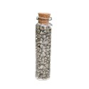 Frasco de cristal com lascas de pirite